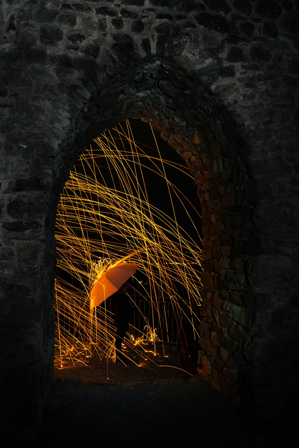 steelwool photography and orange umbrella