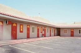 closed red wooden doors
