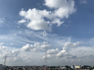 A cityscape showing wireless internet towers with clear skies.