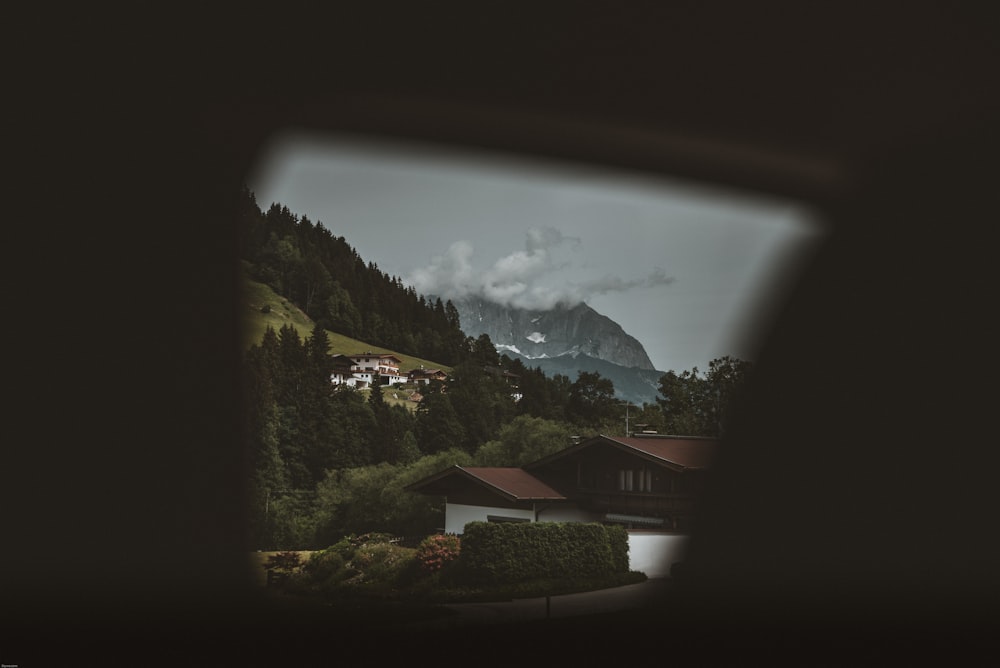 a view of a mountain with a house in the foreground