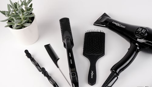 Styling tools for multi-textured hair laying on a table