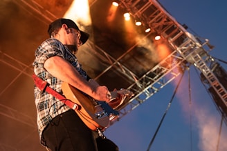 person playing guitar on stage