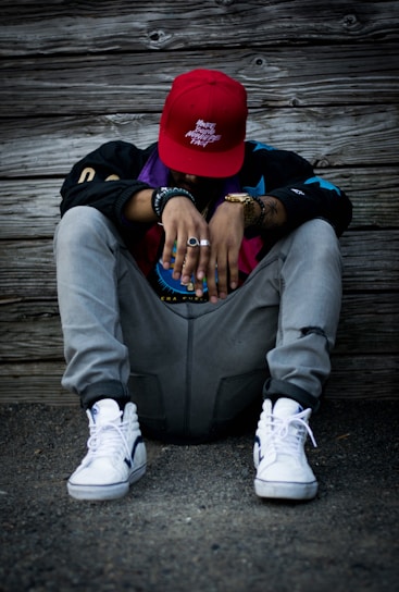 man wearing grey pants and white low-top sneakers