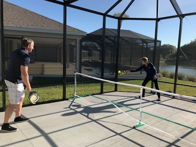 Men’s pickleball apparel showcased during a friendly match under clear skies.
