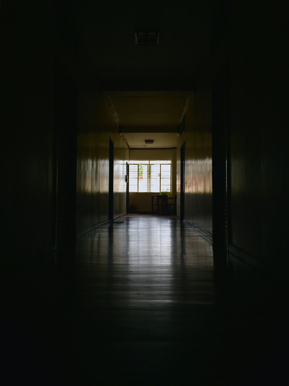 dim-lit empty hallway of a building