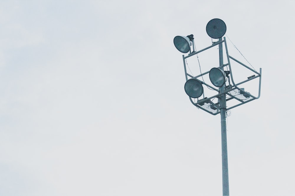 gray megaphones on gray metal post