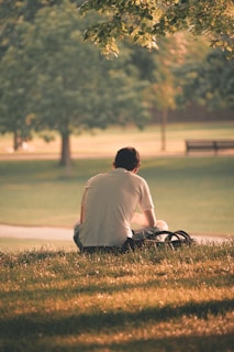 man sat alone in park peacefully