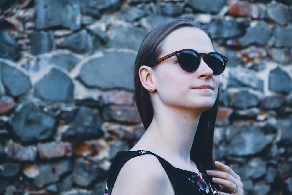 women's wearing black framed sunglasses