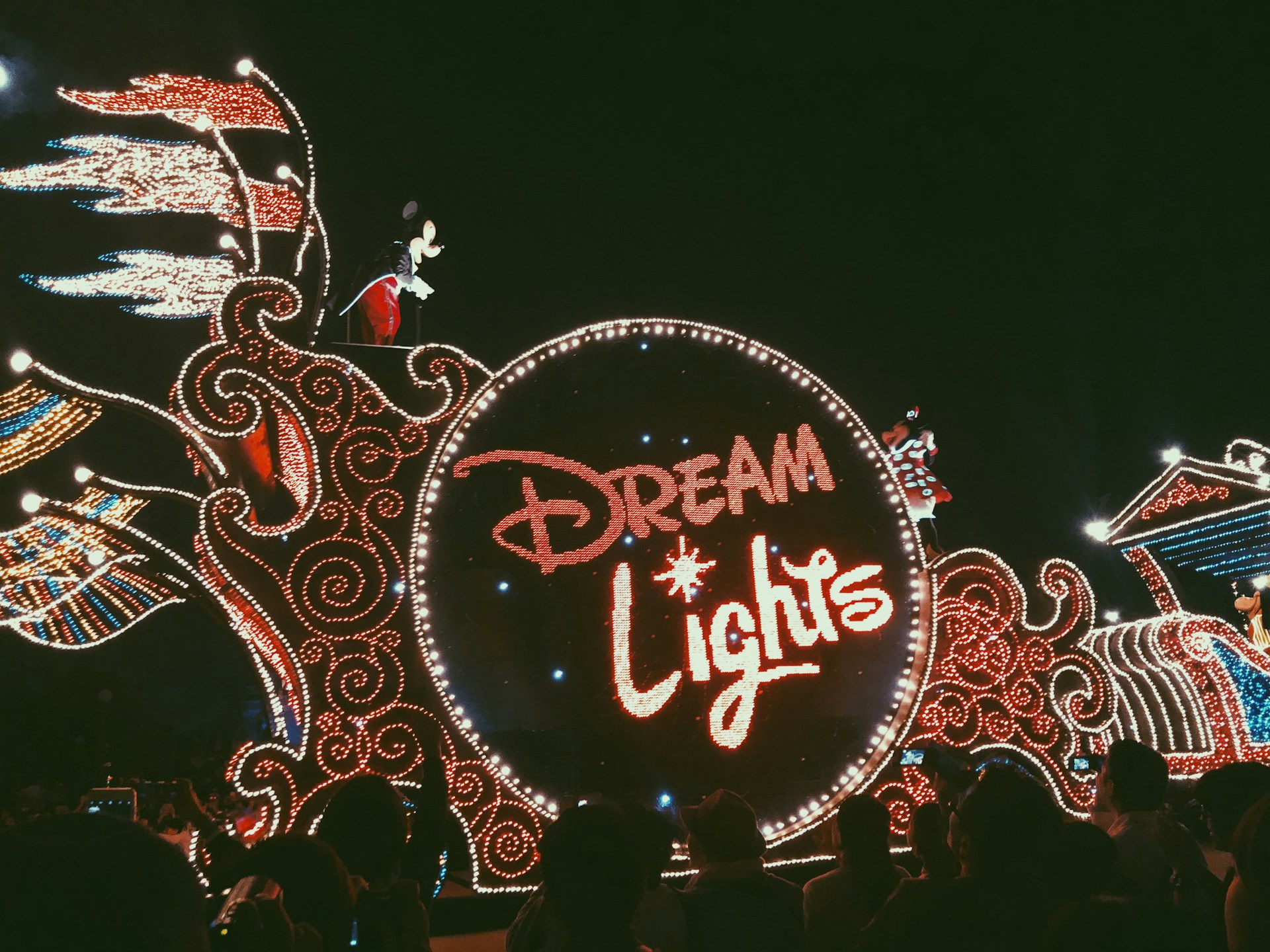 woman wearing yellow long-sleeved dress under white clouds and blue sky during daytime