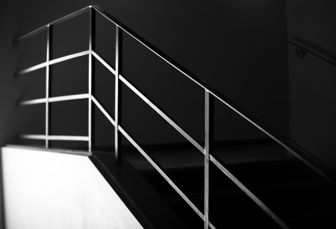 grey metal handrail on stairway