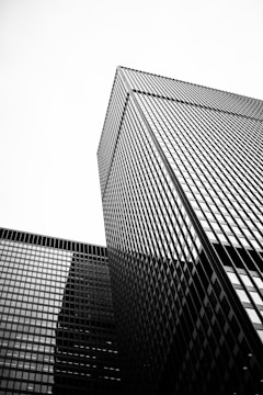 grayscale photo of glass building