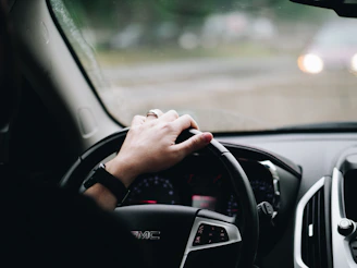 person driving GMC vehicle