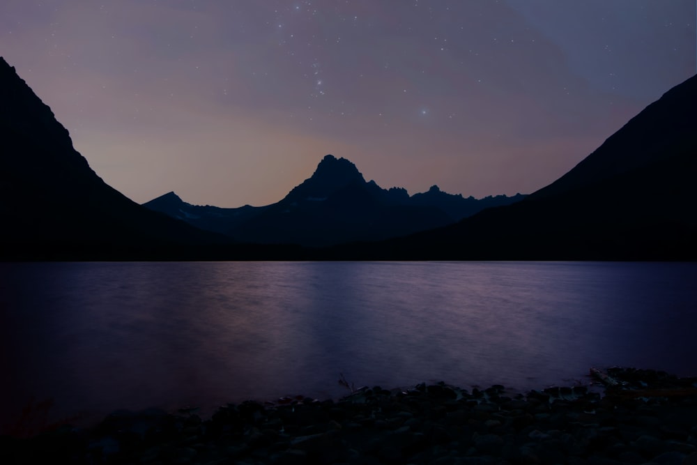 body of water near mountain