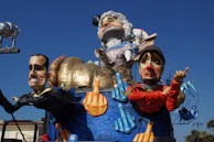 An editorial cartoon showing a parliament building as a circus tent full of colorful characters.