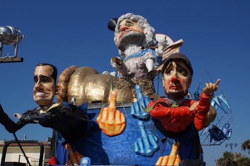 A colorful cartoon depicting exaggerated political figures in a humorous street protest.