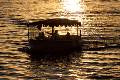 A peaceful sunset view from a private lancha cruising along Ilhabela's coastline