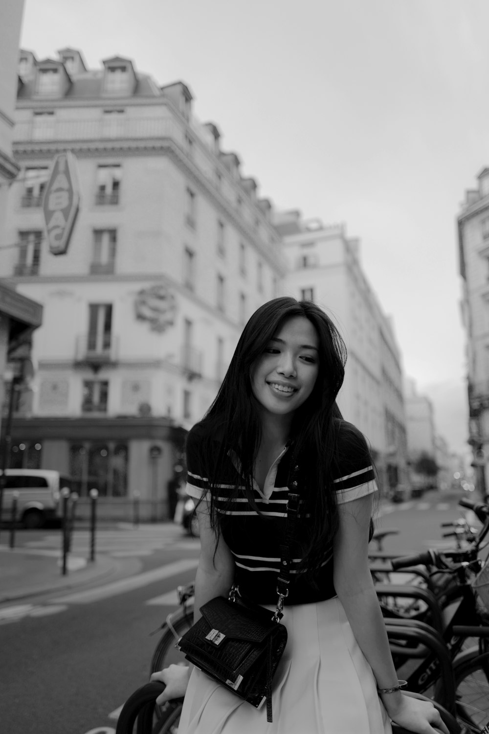 grayscale photo of woman sit on bicycle