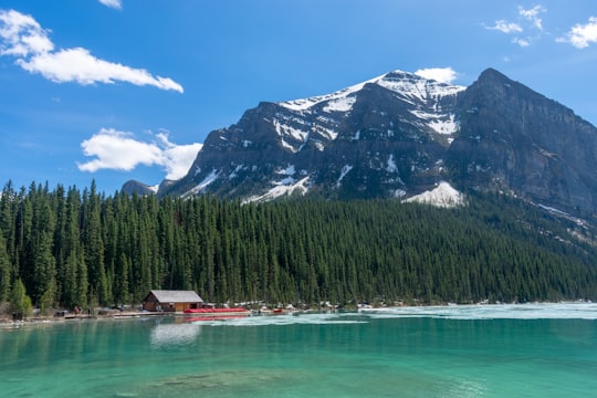 black mountain covered with snow in Fairmont Chateau Lake Louise Canada