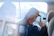 smiling man inside vehicle doing thumbs up during daytime
