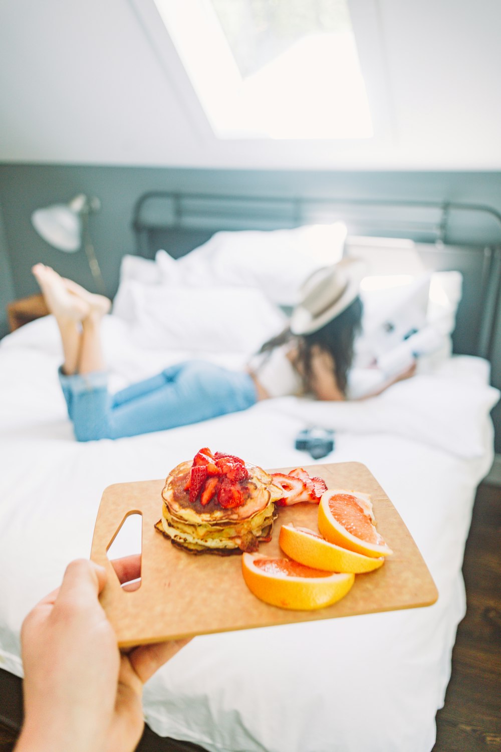 selective focus photography of person holding tray of food