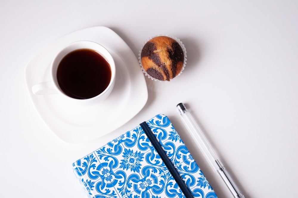 white ceramic cup with coffee