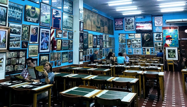 Cozy restaurant interior with traditional Nicaraguan decorations in dark and accent blues.