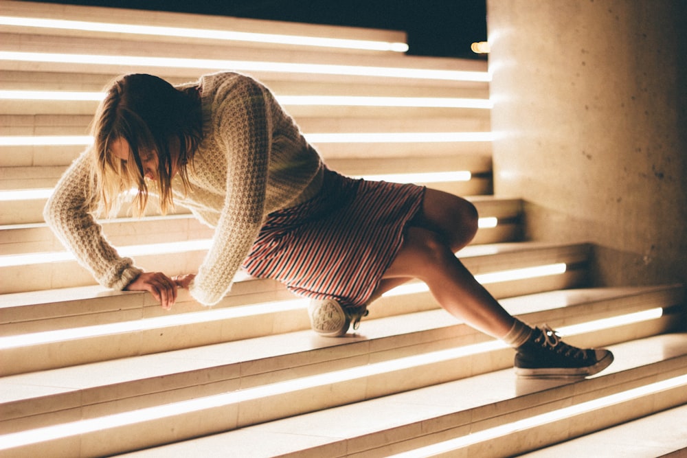 woman sitting down on stair