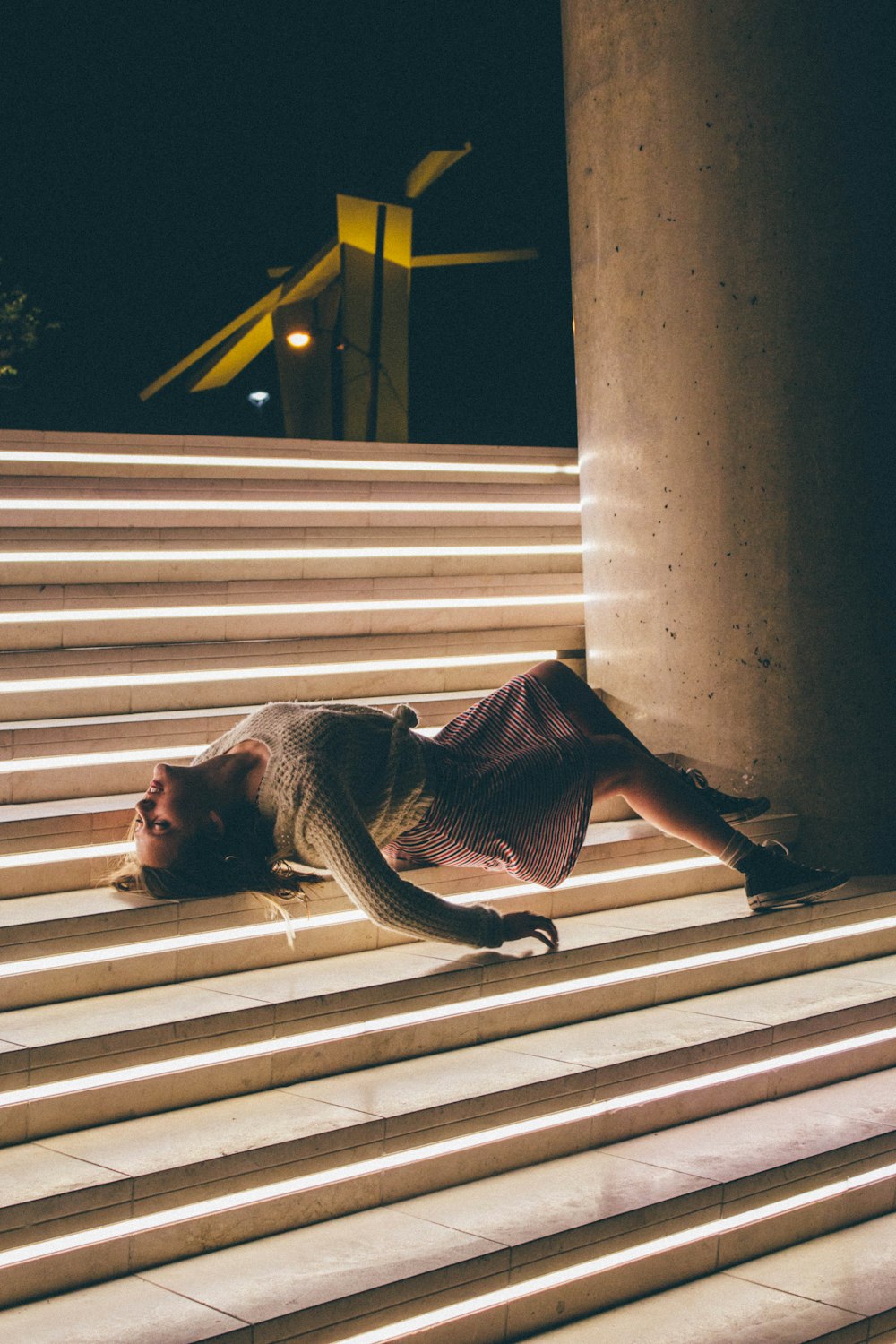 woman lying on stairs