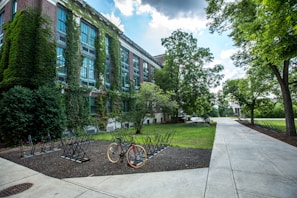 black bicycle parked in front of building