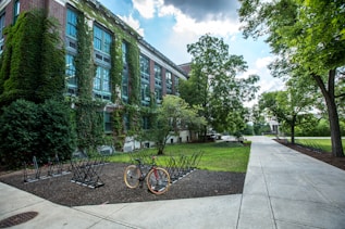 black bicycle parked in front of building