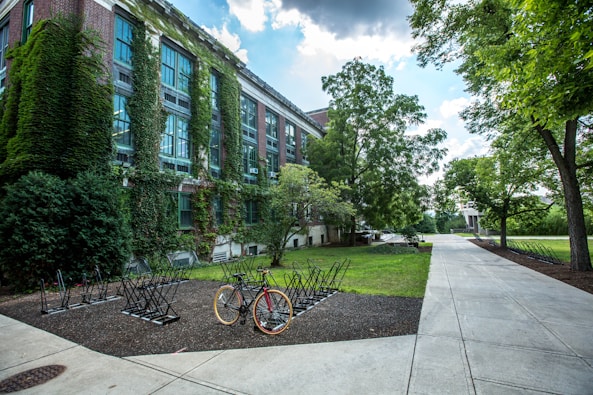 black bicycle parked in front of building