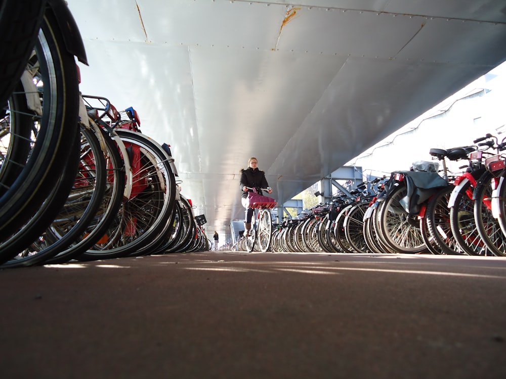 person riding a bike surrounded with bikes