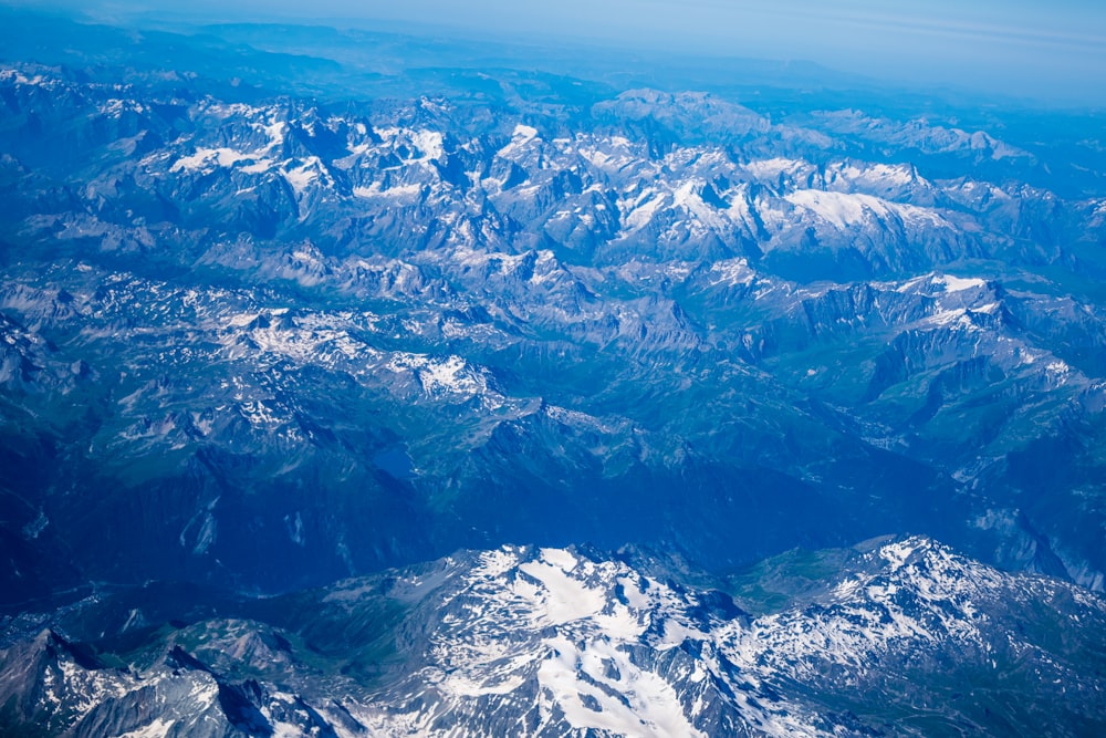 aerial photo of snow covered mountains