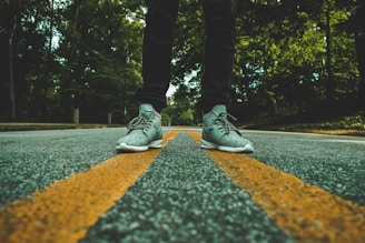 person standing on concrete road