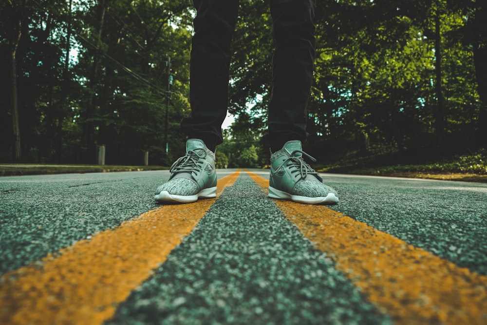 person standing on concrete road