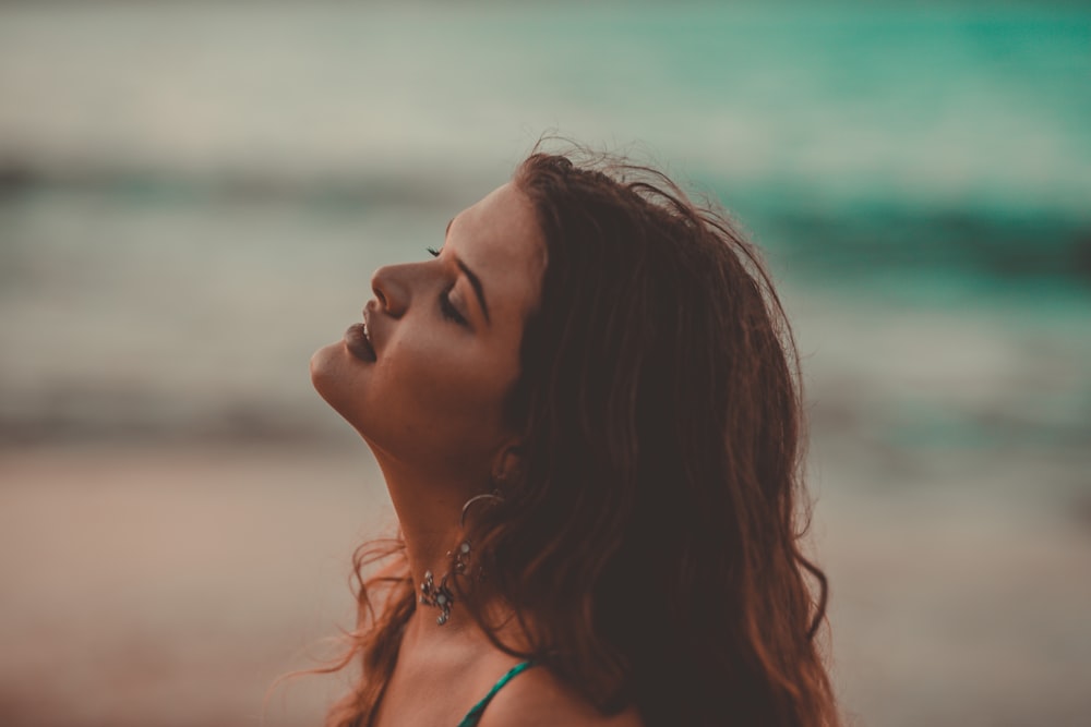 woman standing near body of water