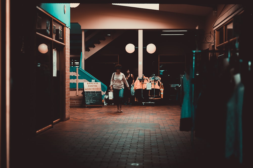 woman walking on brown tiles