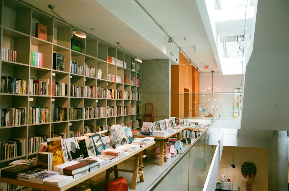 wooden bookcase and tables inside library