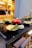 A stylish kitchen featuring Coralbeam cookware.