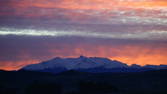 sunset over snow-cover mountain range in Southland New Zealand