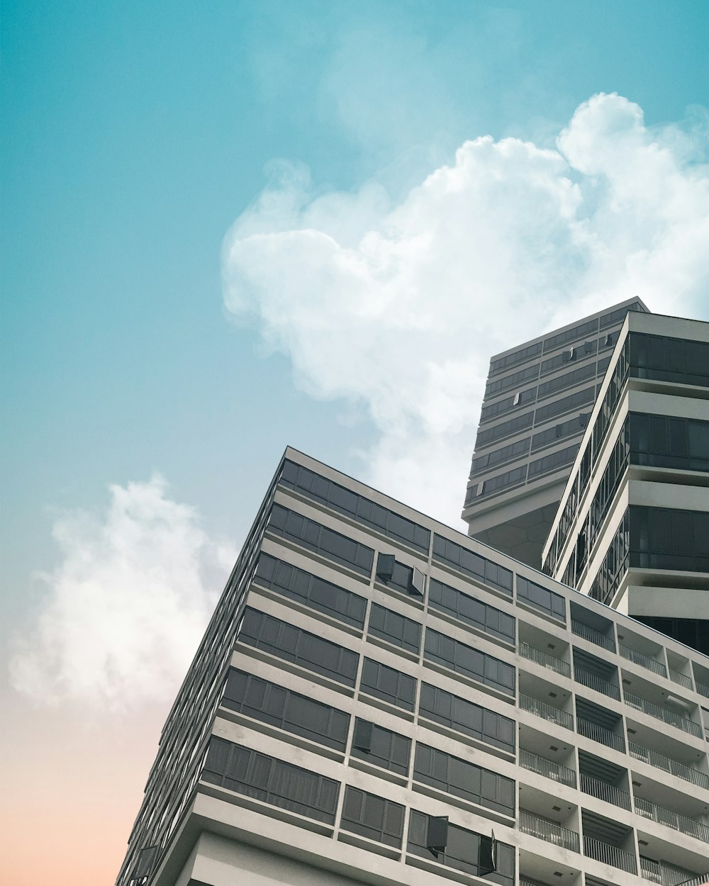 close-up photography of curtain wall building during daytime