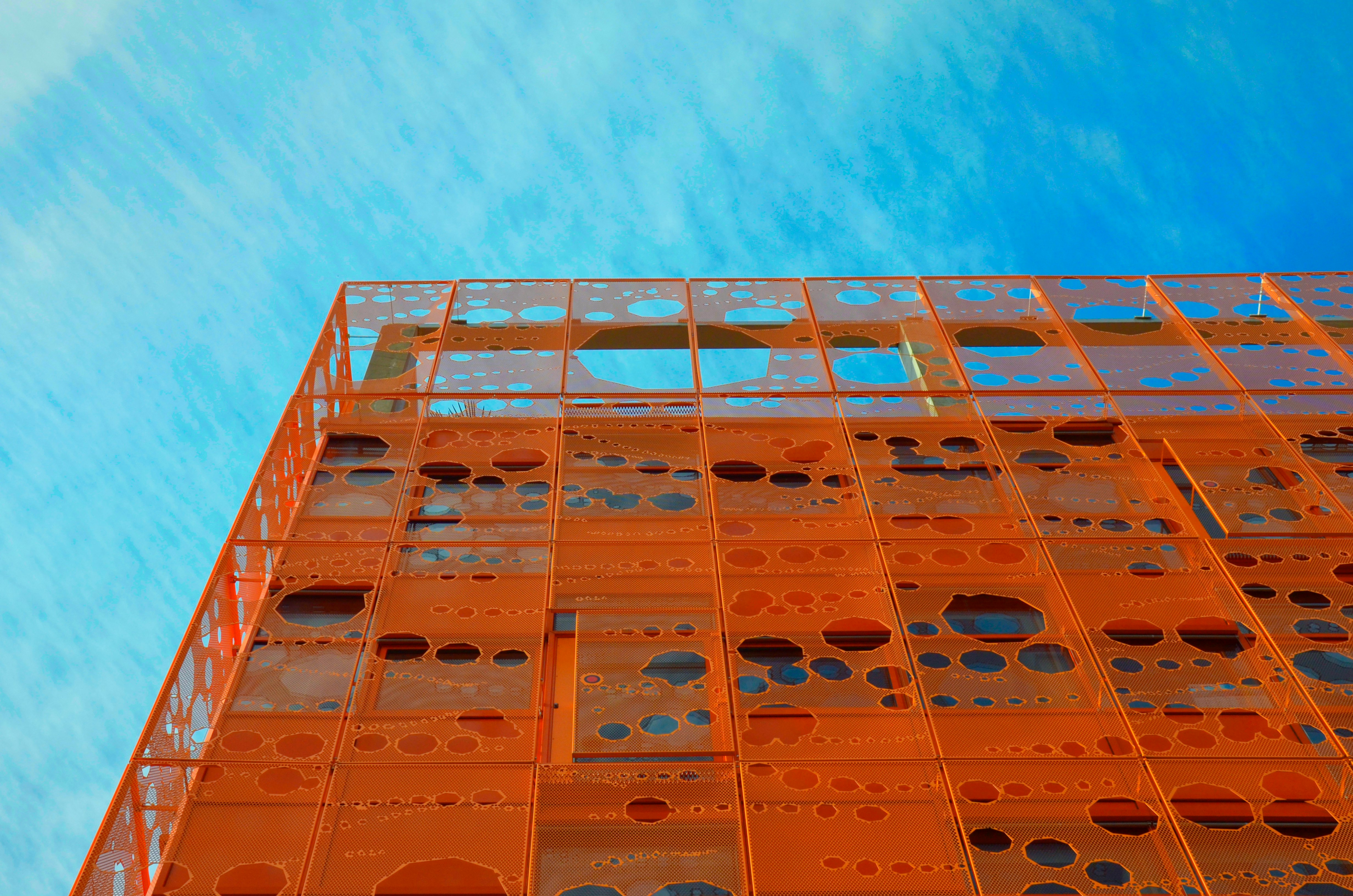 low-angle photography of orange structure