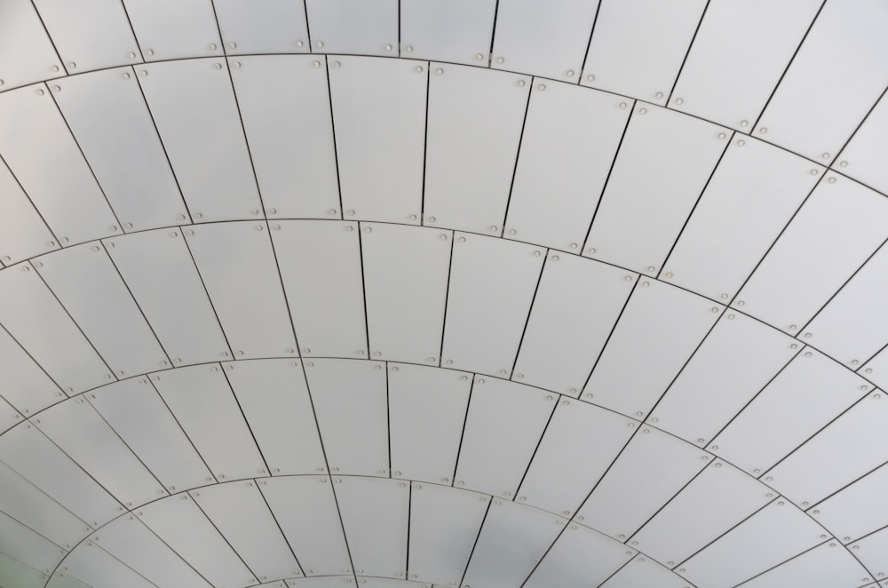 a large white structure with a sky background