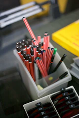 An assortment of branded pens, magnets, and stress balls arranged neatly.