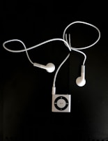 Vibrant blue MP3 player next to fresh workout gear on a gym floor.