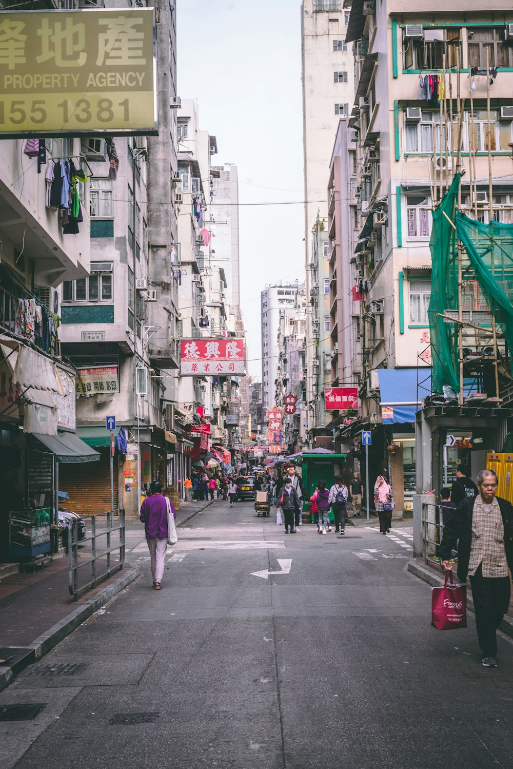 people walking in the middle of road