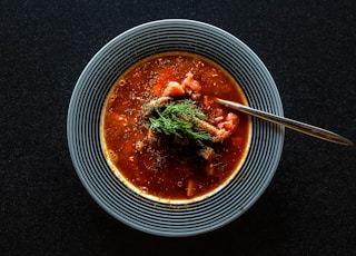 soup with vegetable on gray bowl