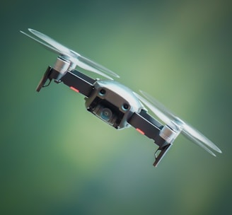 selective focus photography of gray and black quadcopter drone
