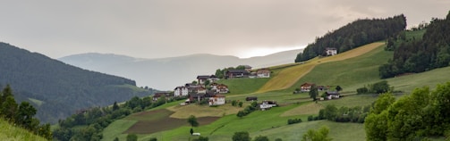 A picturesque rural landscape with a blend of farmland and tourism facilities.