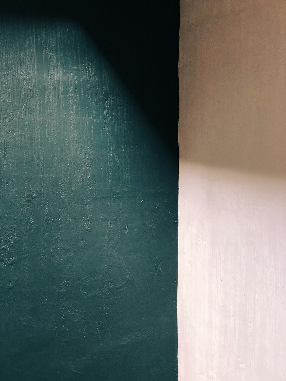 a black and white photo of a corner of a room